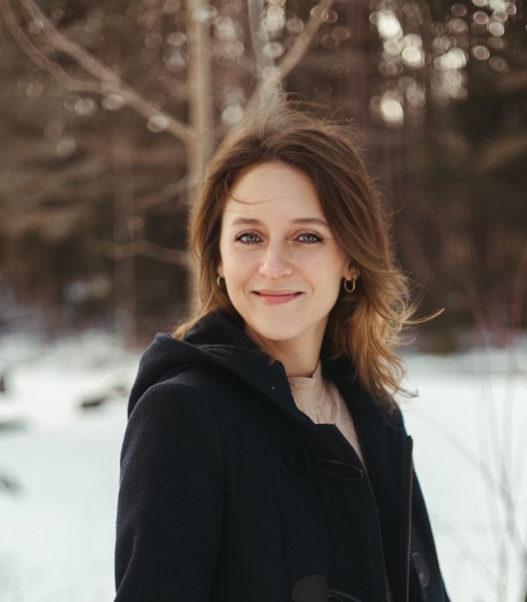 Caitlin Boyd standing outside in a black jacket