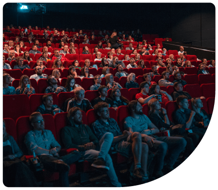 Full theatre at documentary film showing